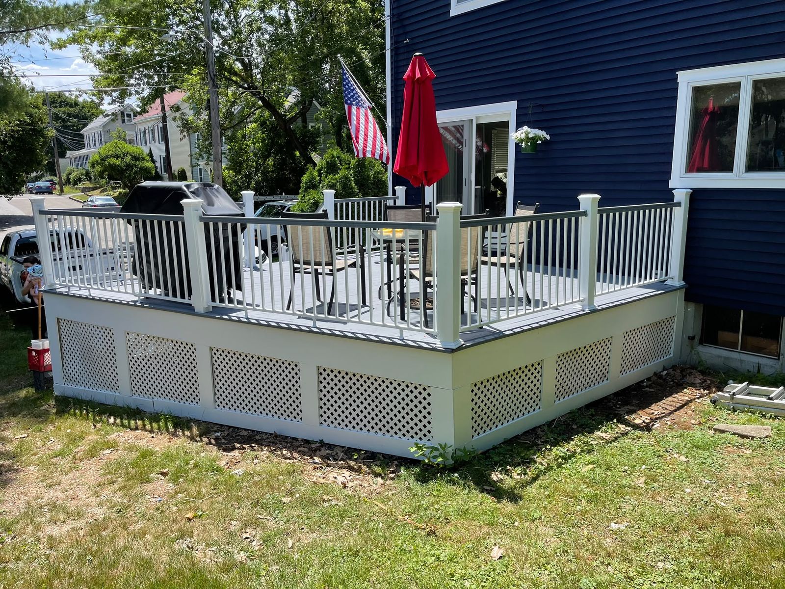 Backyard composite deck with white railings