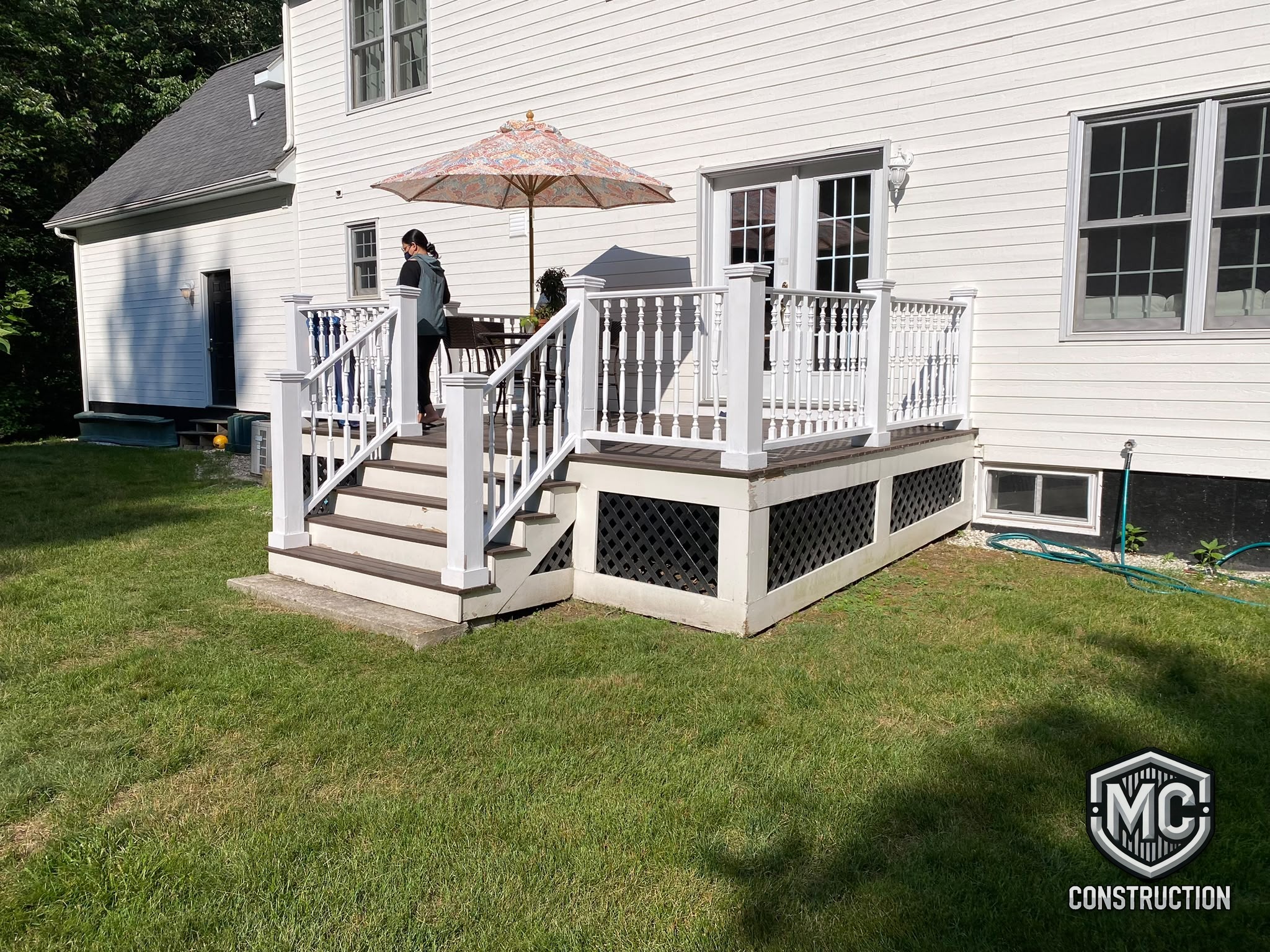 Composite deck with stairs and lattice skirting