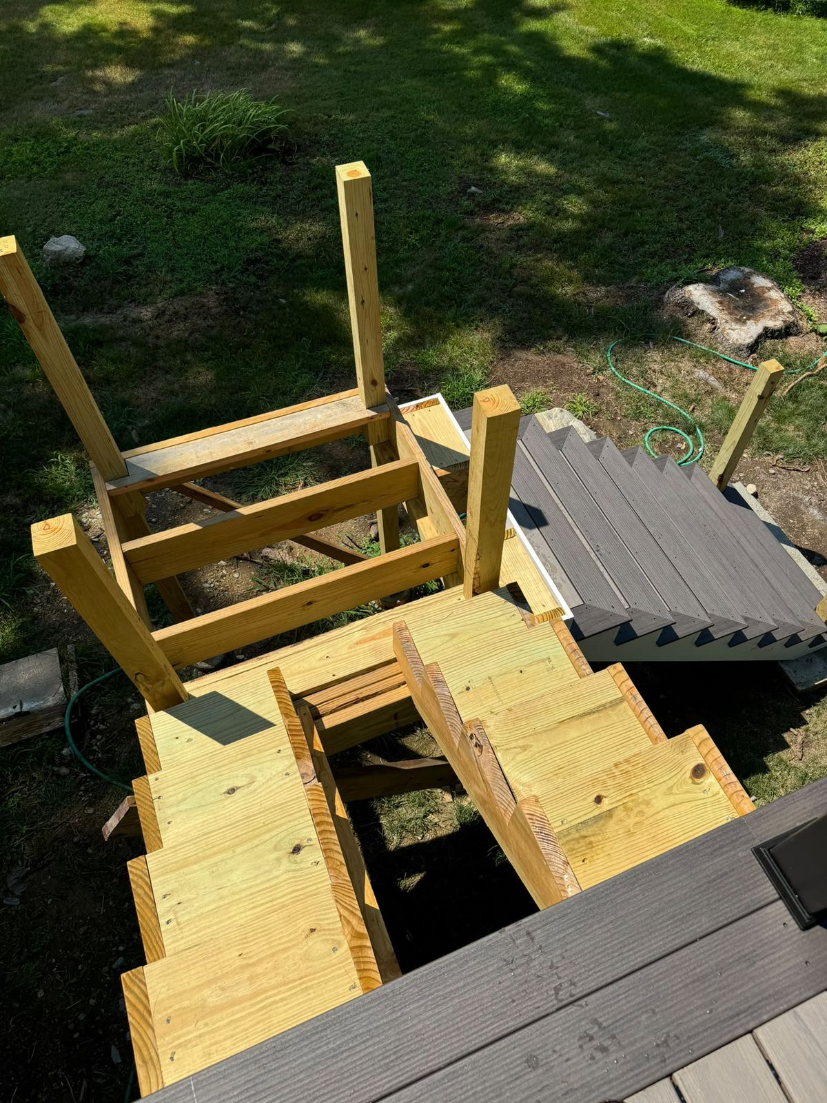 Pressure-treated deck stair framing by local deck builder